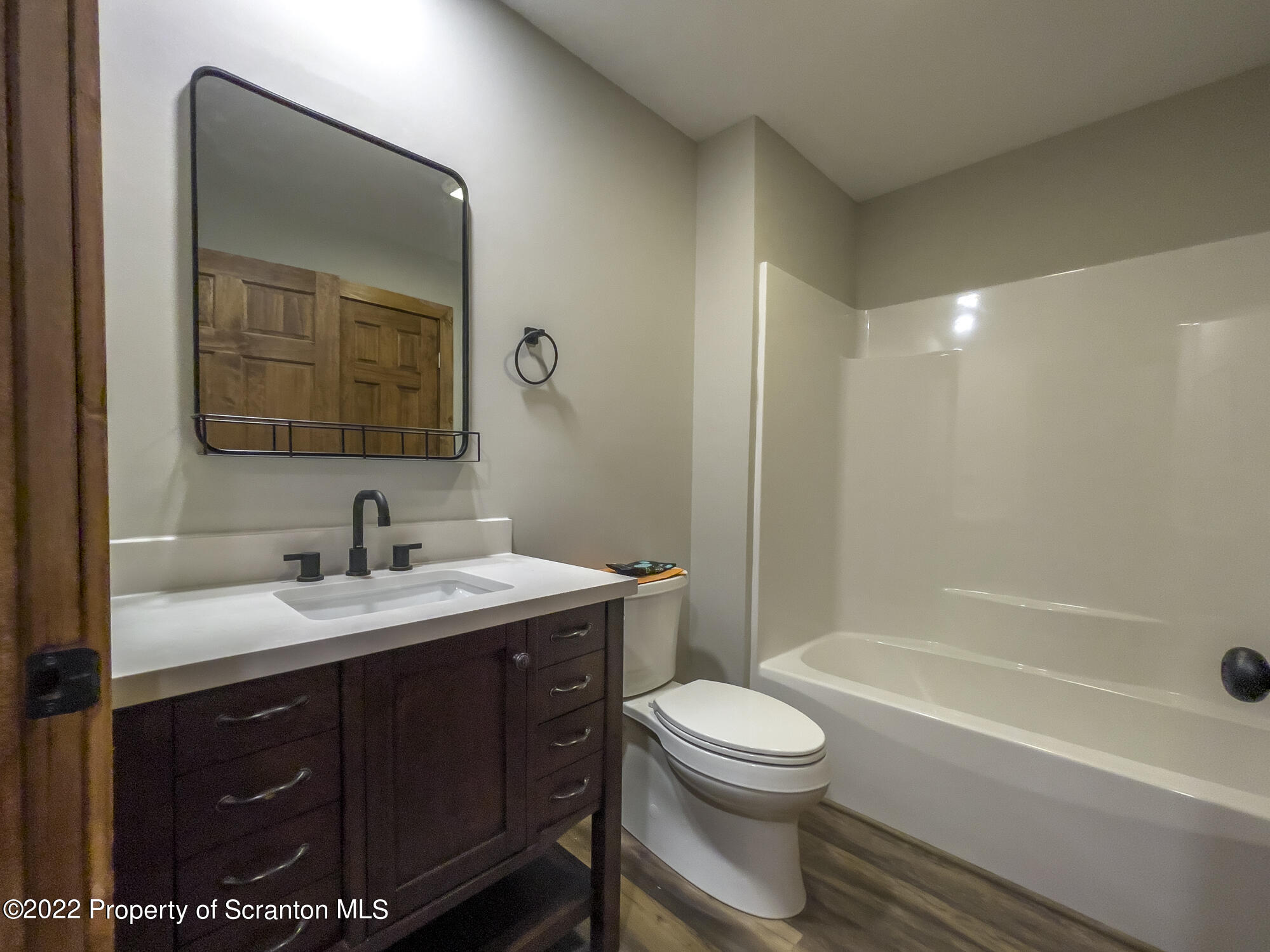 311 Jubinsky Road Waymart, PA 18472 - Photo 53 of 89 a bathroom with a toilet a sink a mirror a bathtub and vanity