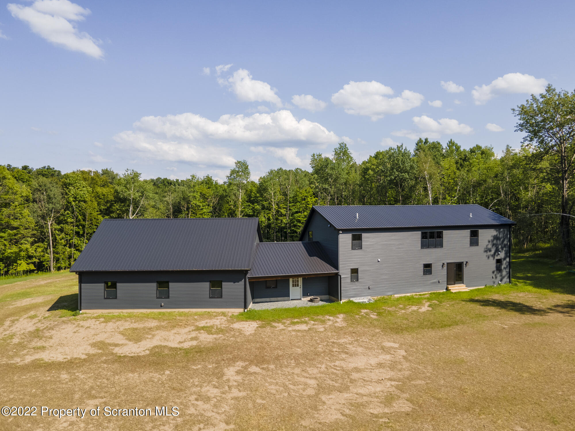 311 Jubinsky Road Waymart, PA 18472 - Photo 83 of 89 a front view of a house with a yard
