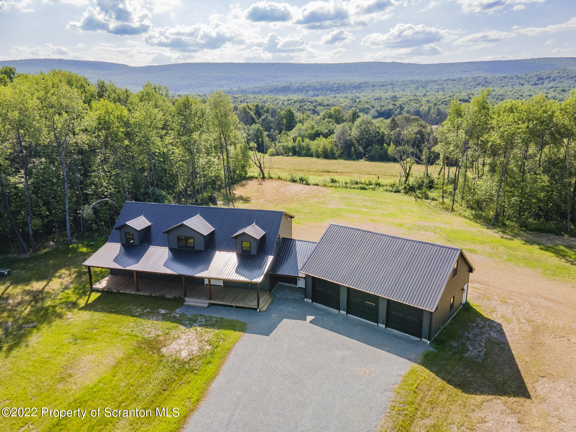 311 Jubinsky Road Waymart, PA 18472 - Photo 87 of 89 a view of a swimming pool with a patio