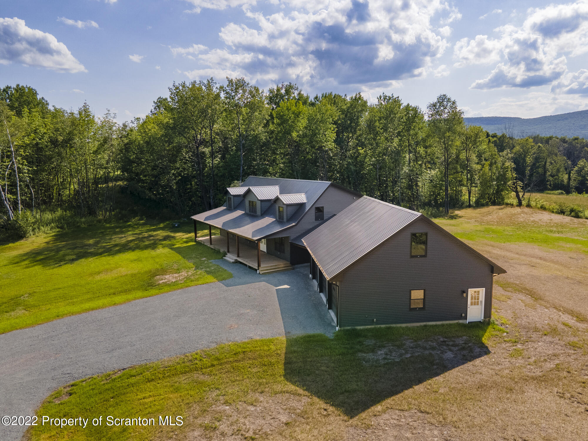 311 Jubinsky Road Waymart, PA 18472 - Photo 89 of 89 a view of a house with pool and a yard