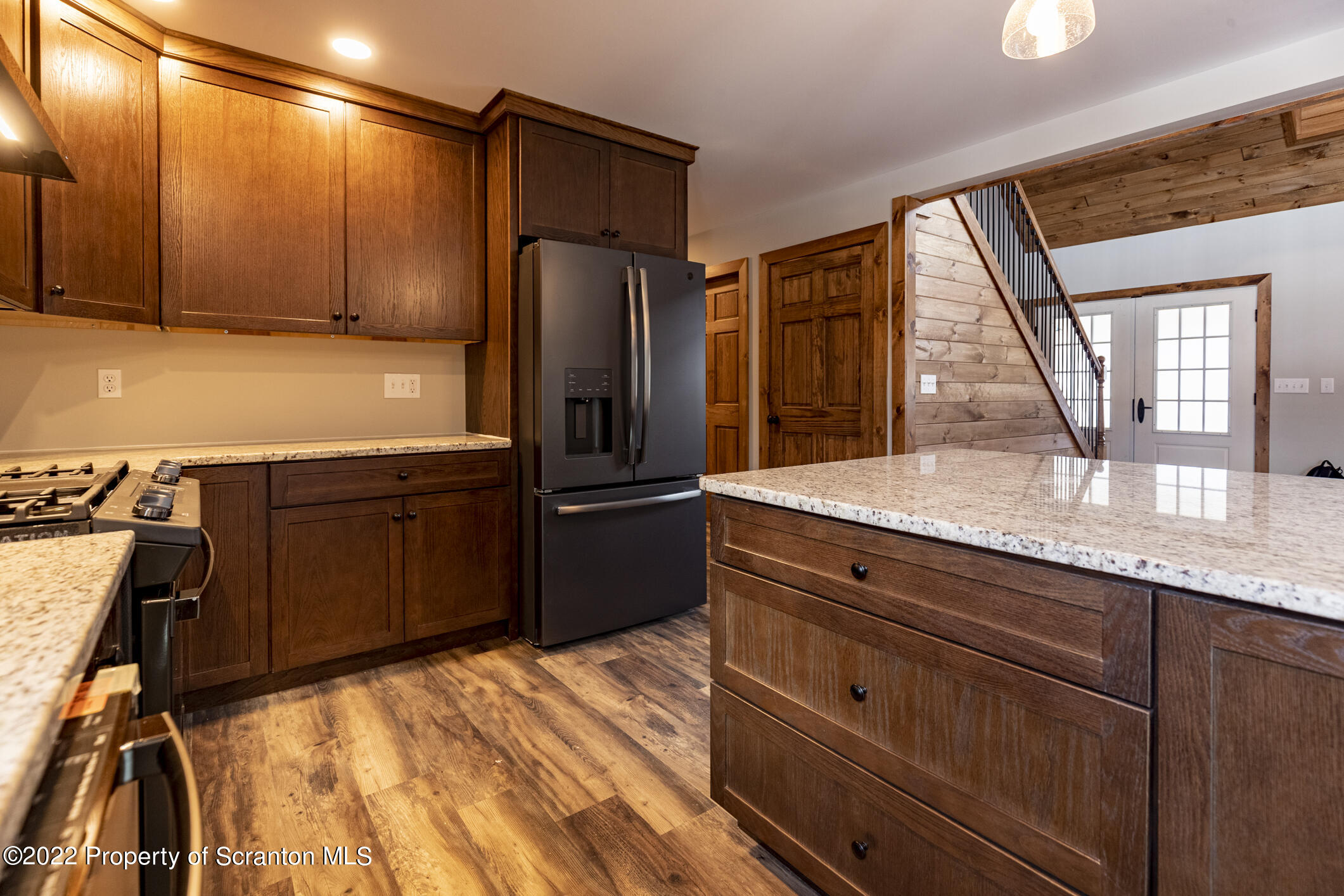 311 Jubinsky Road Waymart, PA 18472 - Photo 10 of 89 a kitchen with granite countertop wooden cabinets and refrigerator