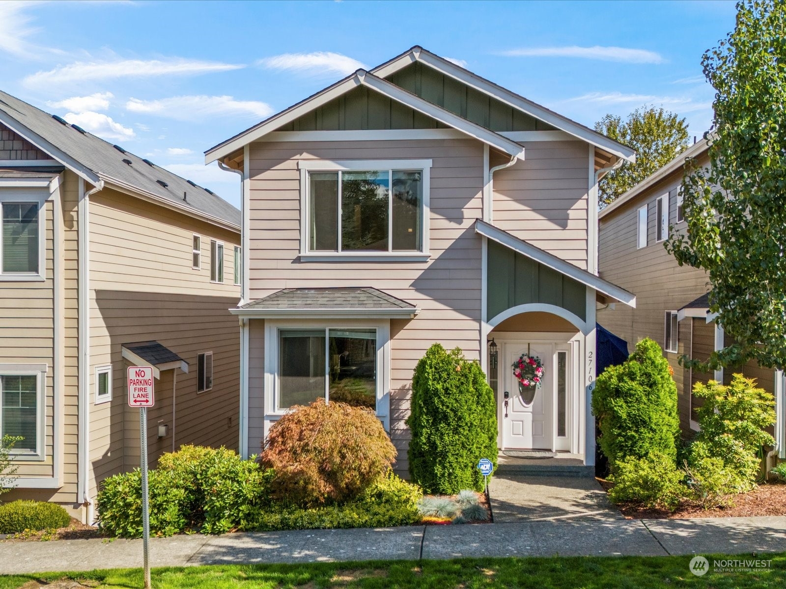 a front view of a house with garden