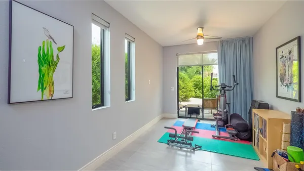 a bedroom with bed and a window