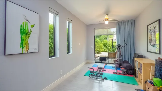 a bedroom with bed and a window