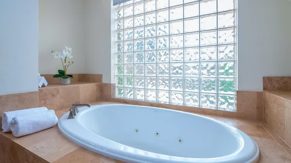 a bathroom with a bathtub and sink