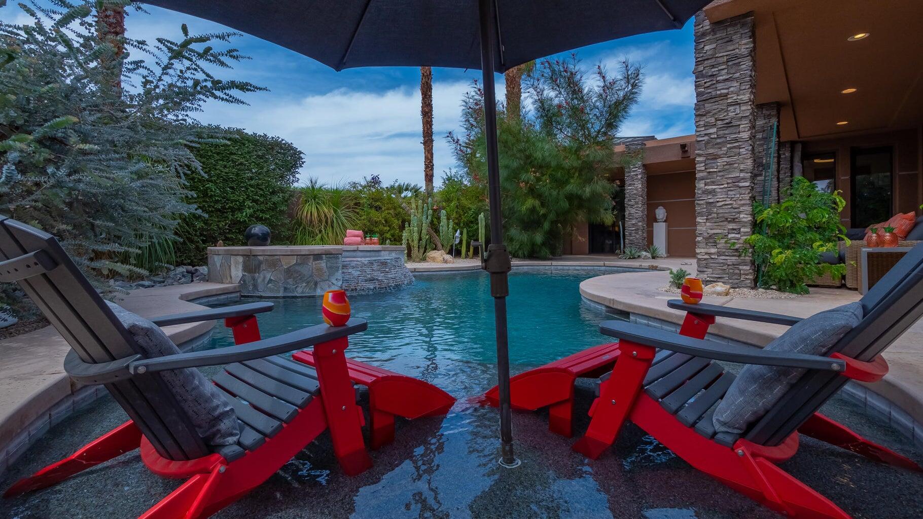 2 Dominion Court Rancho Mirage, CA 92270 - Photo 26 of 40 an outdoor sitting area with furniture and wooden deck