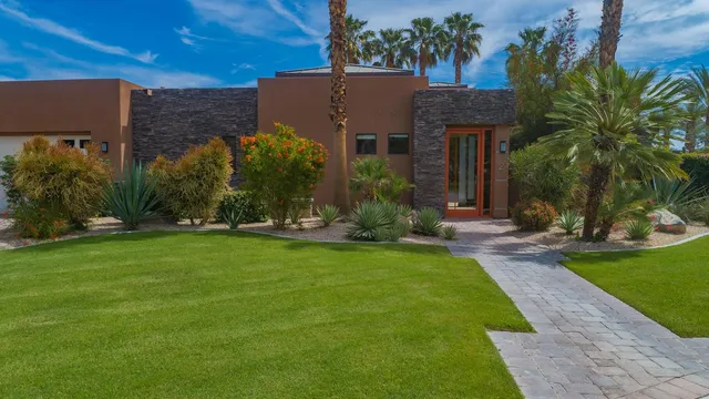 a view of a house with garden and plants