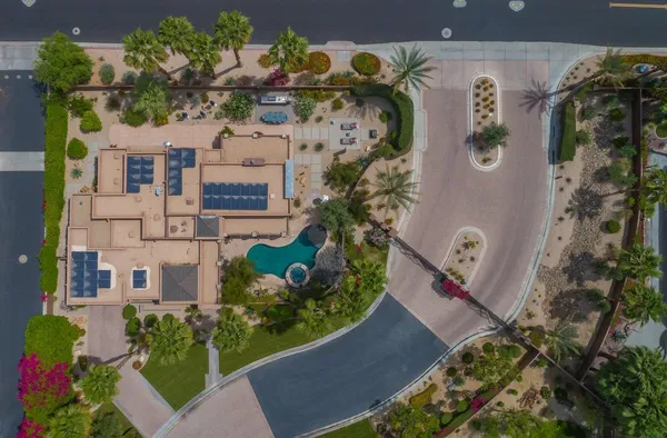 an aerial view of a residential apartment building with yard