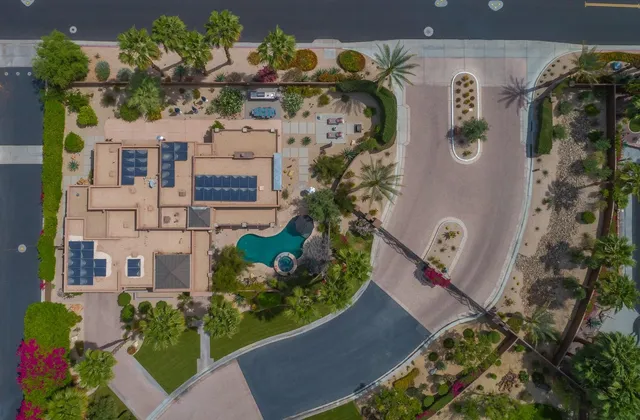 an aerial view of a residential apartment building with yard