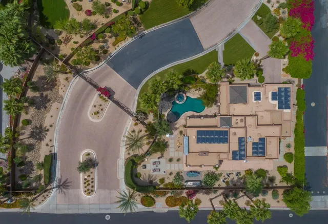an aerial view of a house with outdoor space