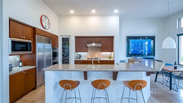 a kitchen with granite countertop lots of counter top space