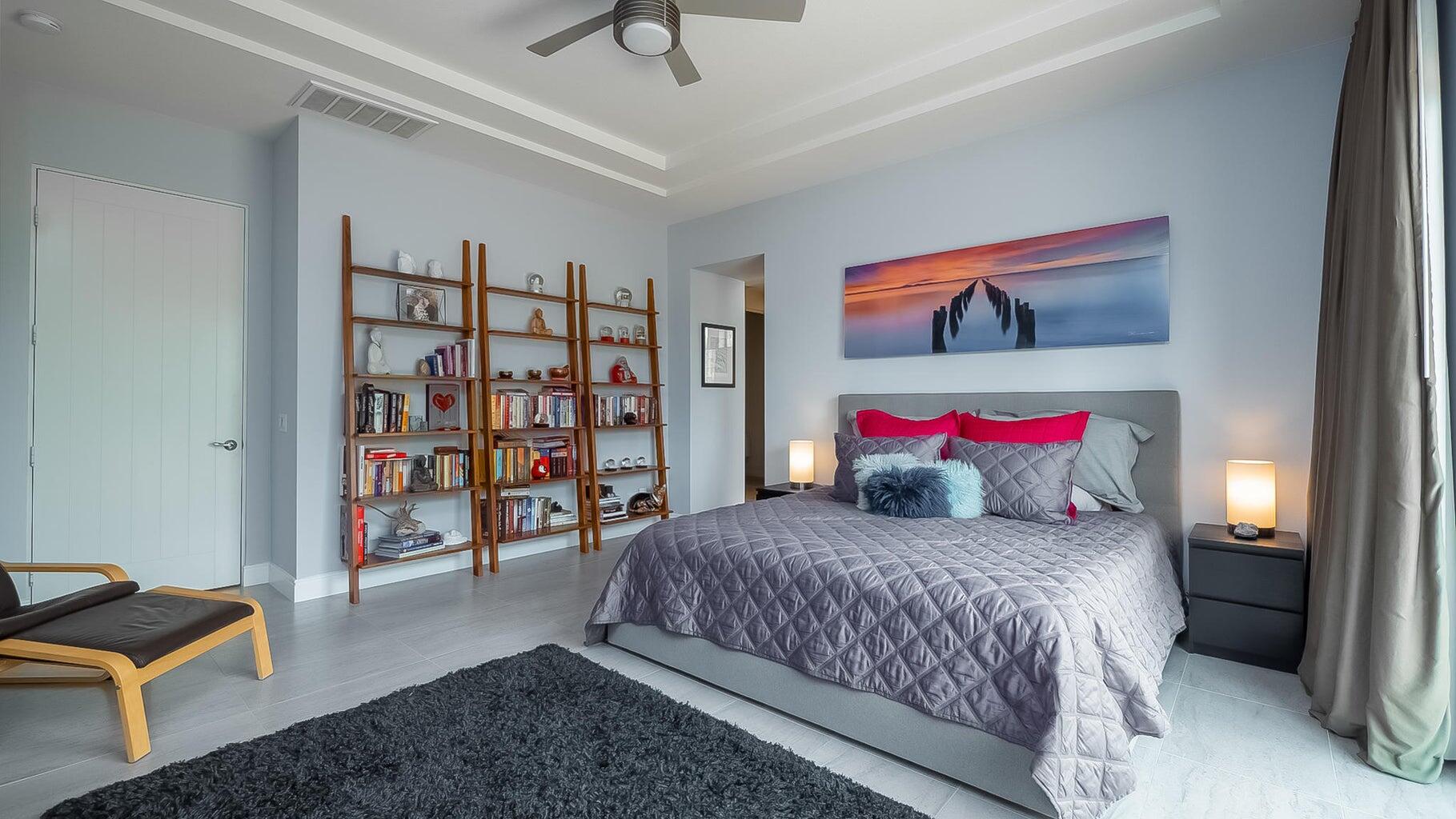 2 Dominion Court Rancho Mirage, CA 92270 - Photo 9 of 40 a bedroom with a bed and a book shelf