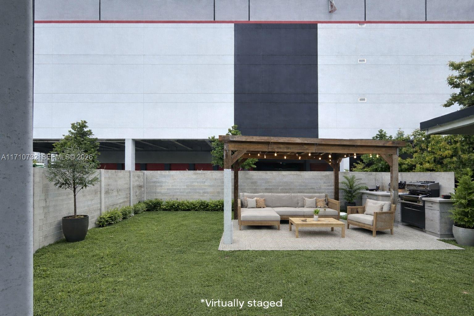 a view of backyard with a table and chairs