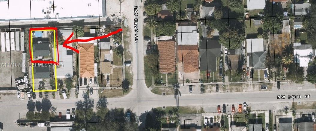 3529 Northwest 34th Street, Unit BACK Miami, FL 33142 - Photo 17 of 17 a city street lined with tall buildings