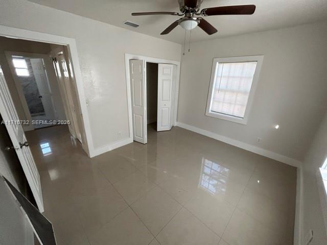 3529 Northwest 34th Street, Unit BACK Miami, FL 33142 - Photo 7 of 17 a view of an empty room with a window