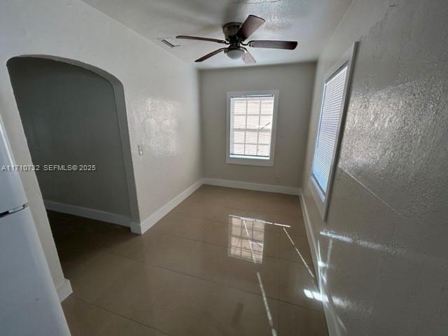 3529 Northwest 34th Street, Unit BACK Miami, FL 33142 - Photo 8 of 12 a view of an empty room with a window