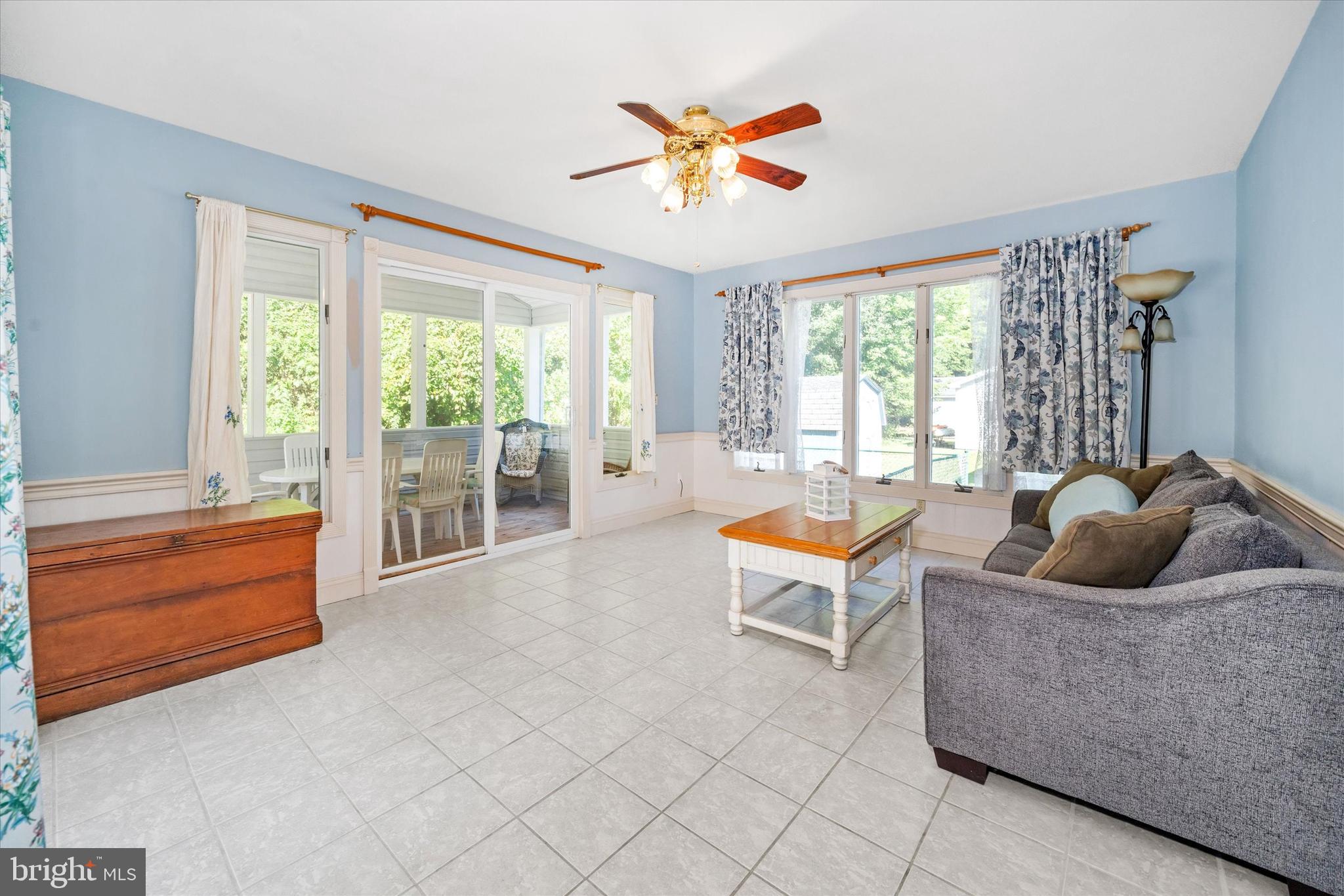 22892 Angola Road East Lewes, DE 19958 - Photo 17 of 48 a living room with furniture and a large window