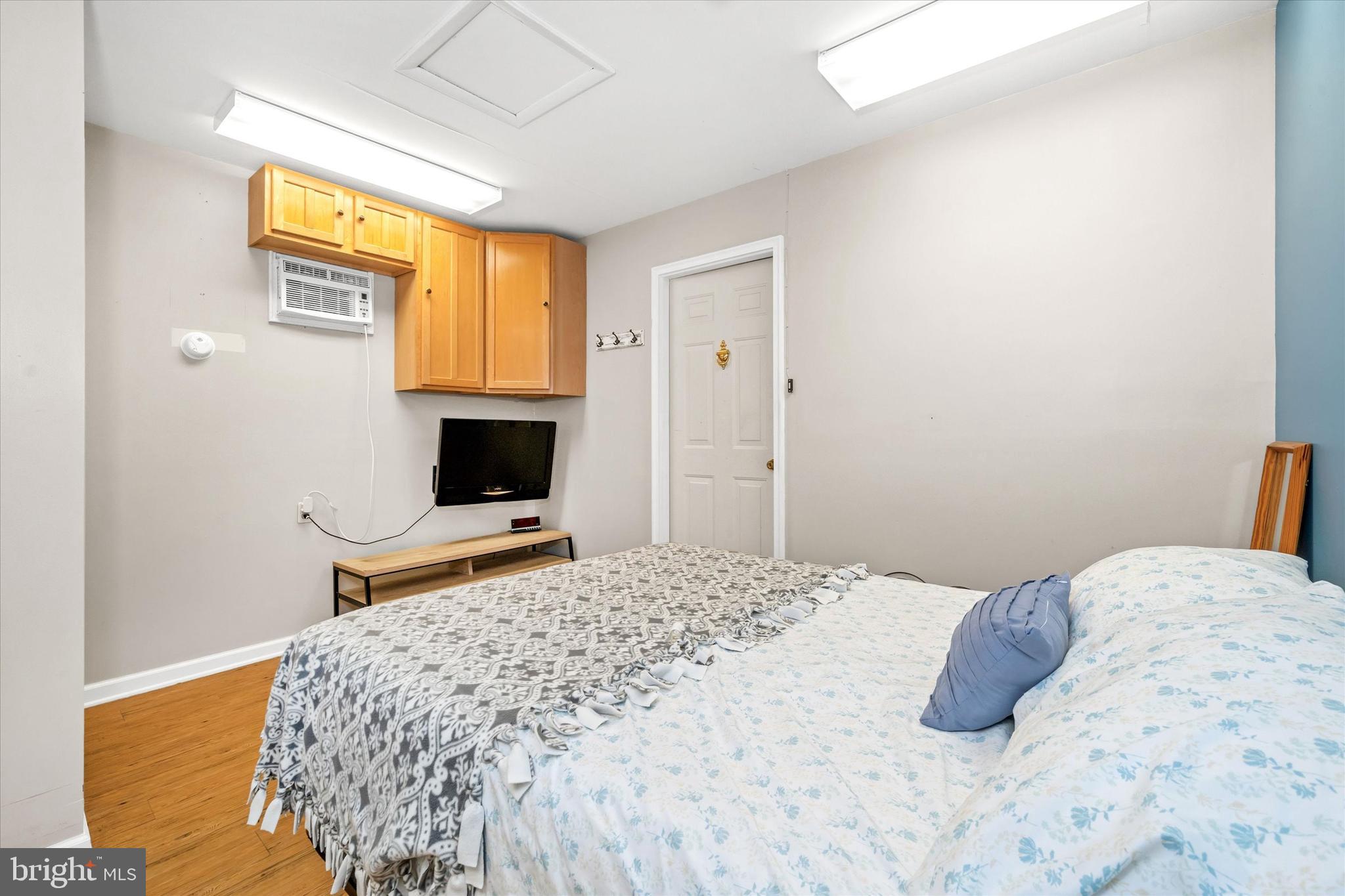 22892 Angola Road East Lewes, DE 19958 - Photo 22 of 48 a bedroom with a bed and window