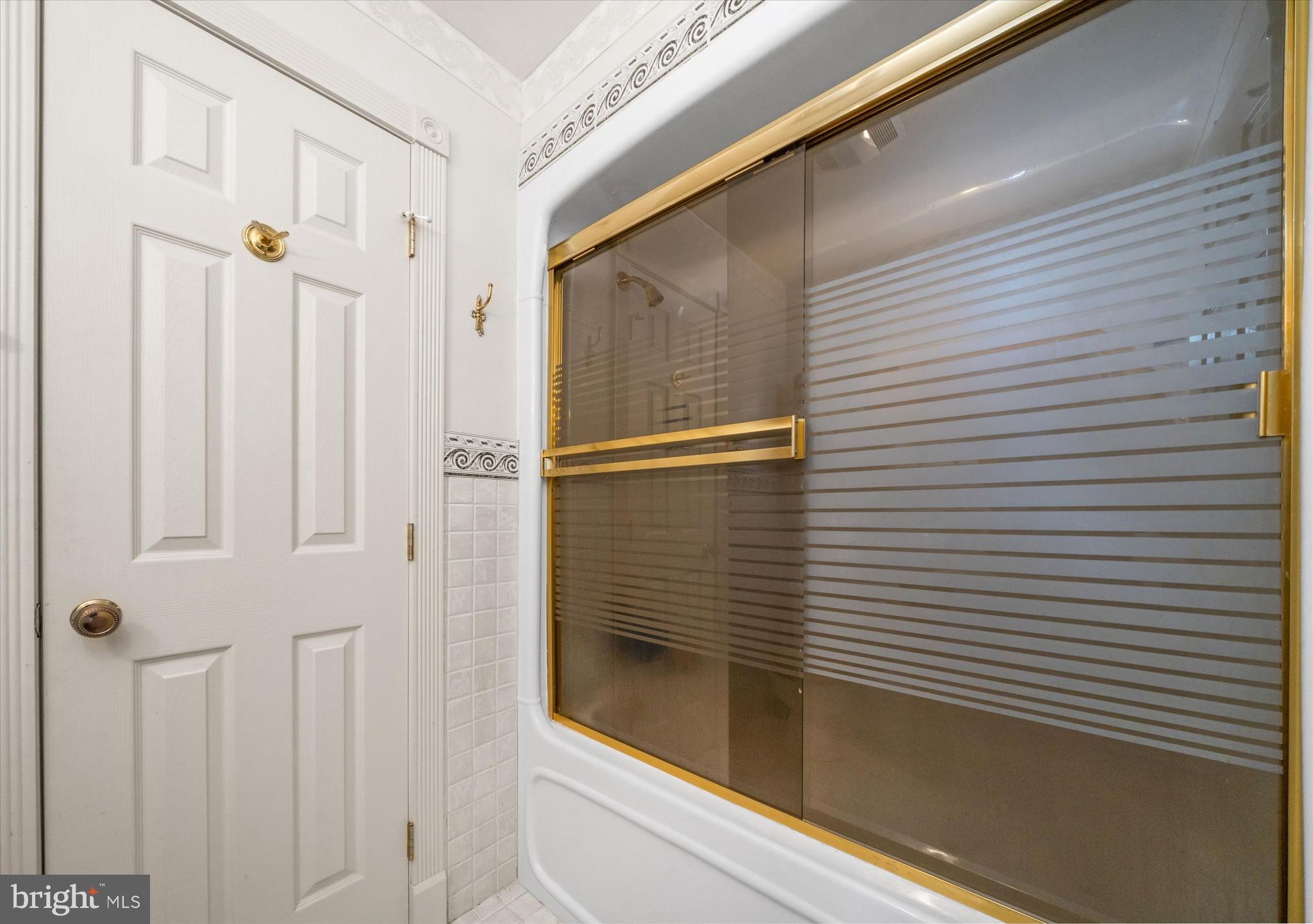 22892 Angola Road East Lewes, DE 19958 - Photo 31 of 48 a bathroom with a shower