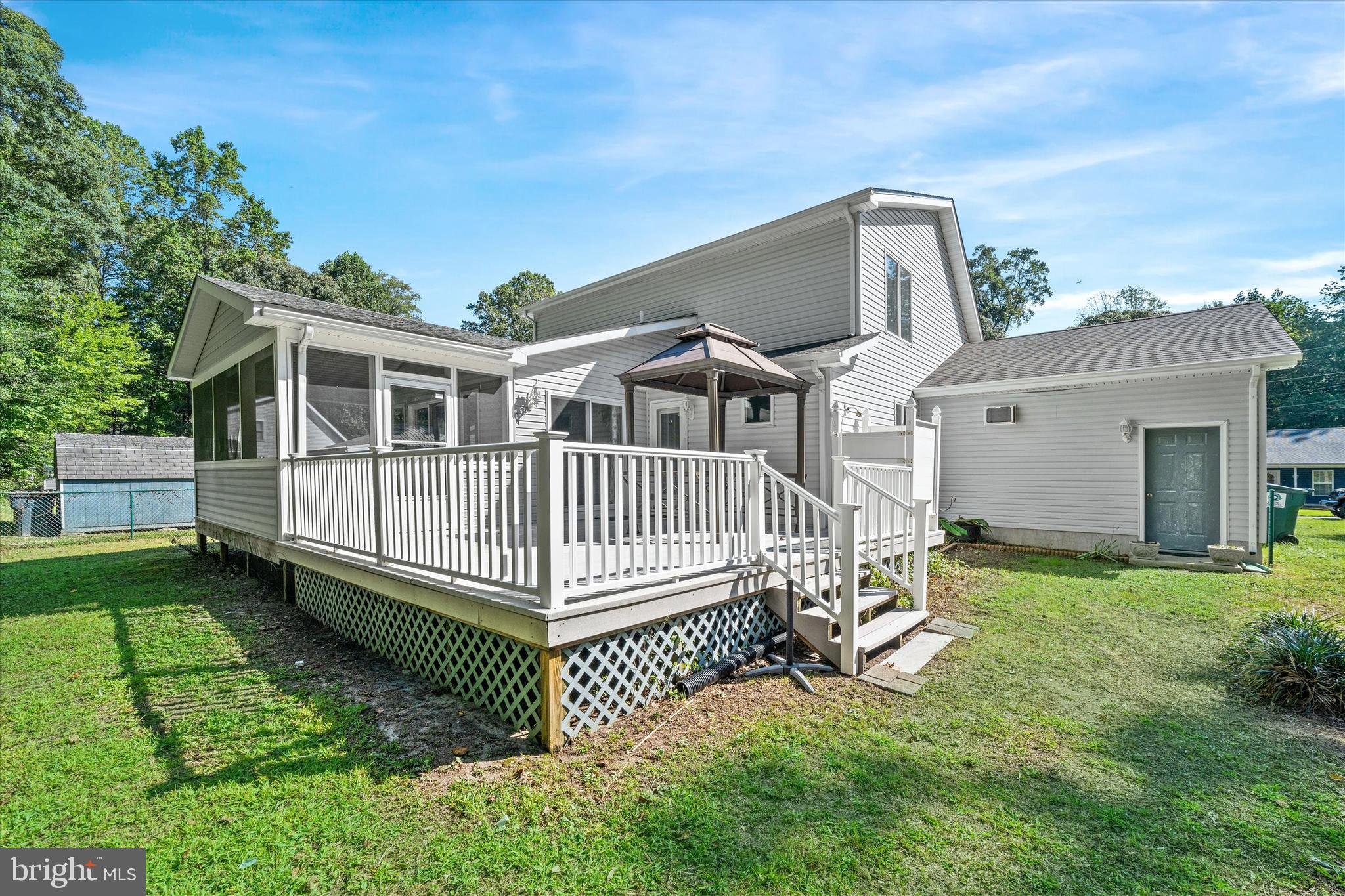22892 Angola Road East Lewes, DE 19958 - Photo 36 of 48 a view of a house with a yard and deck