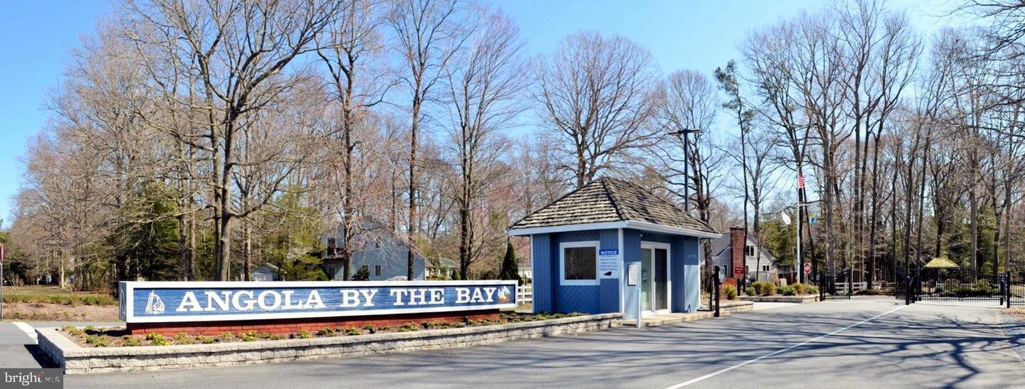 22892 Angola Road East Lewes, DE 19958 - Photo 38 of 48 a view of a house with a bench