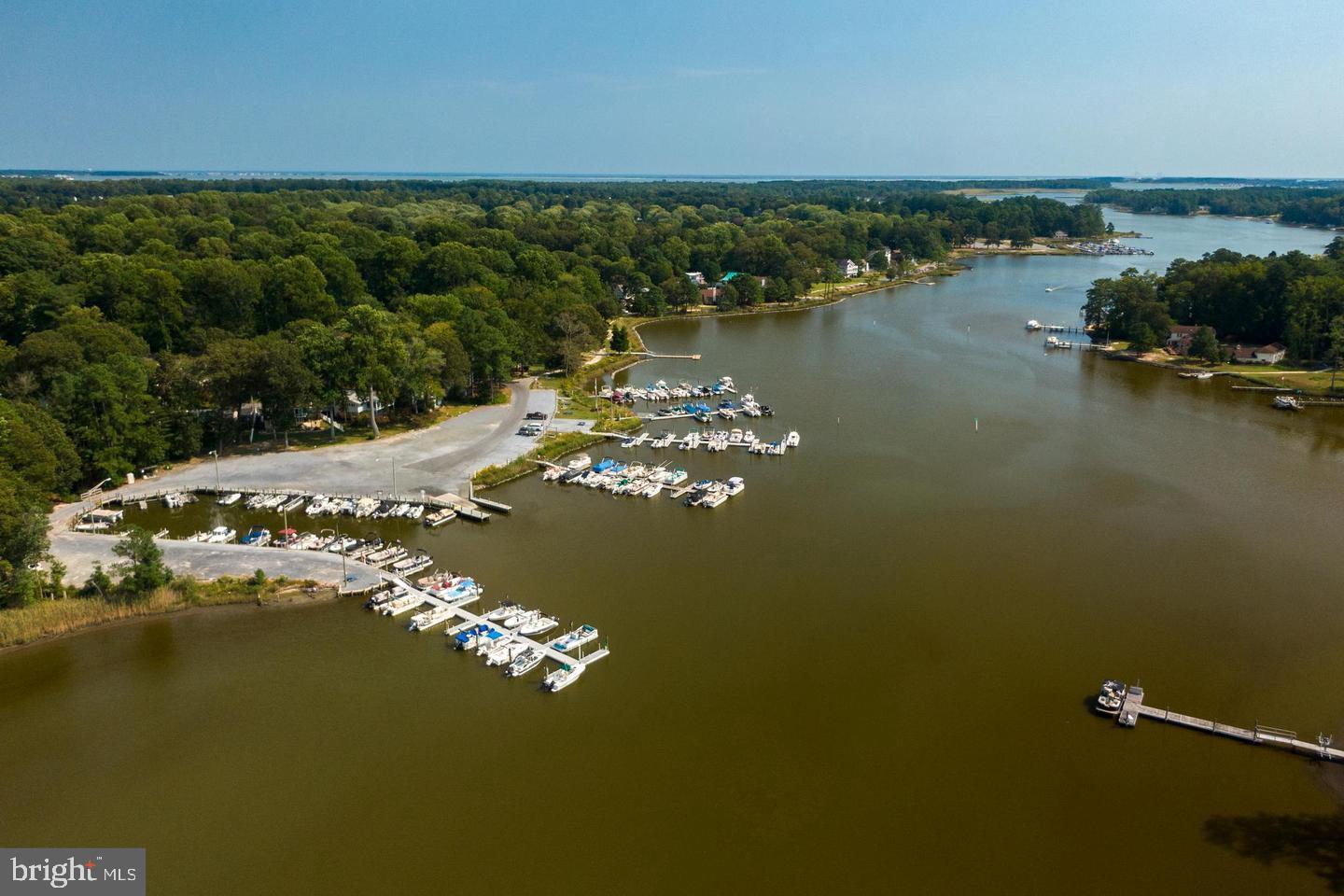 22892 Angola Road East Lewes, DE 19958 - Photo 45 of 48 a view of a lake with a city
