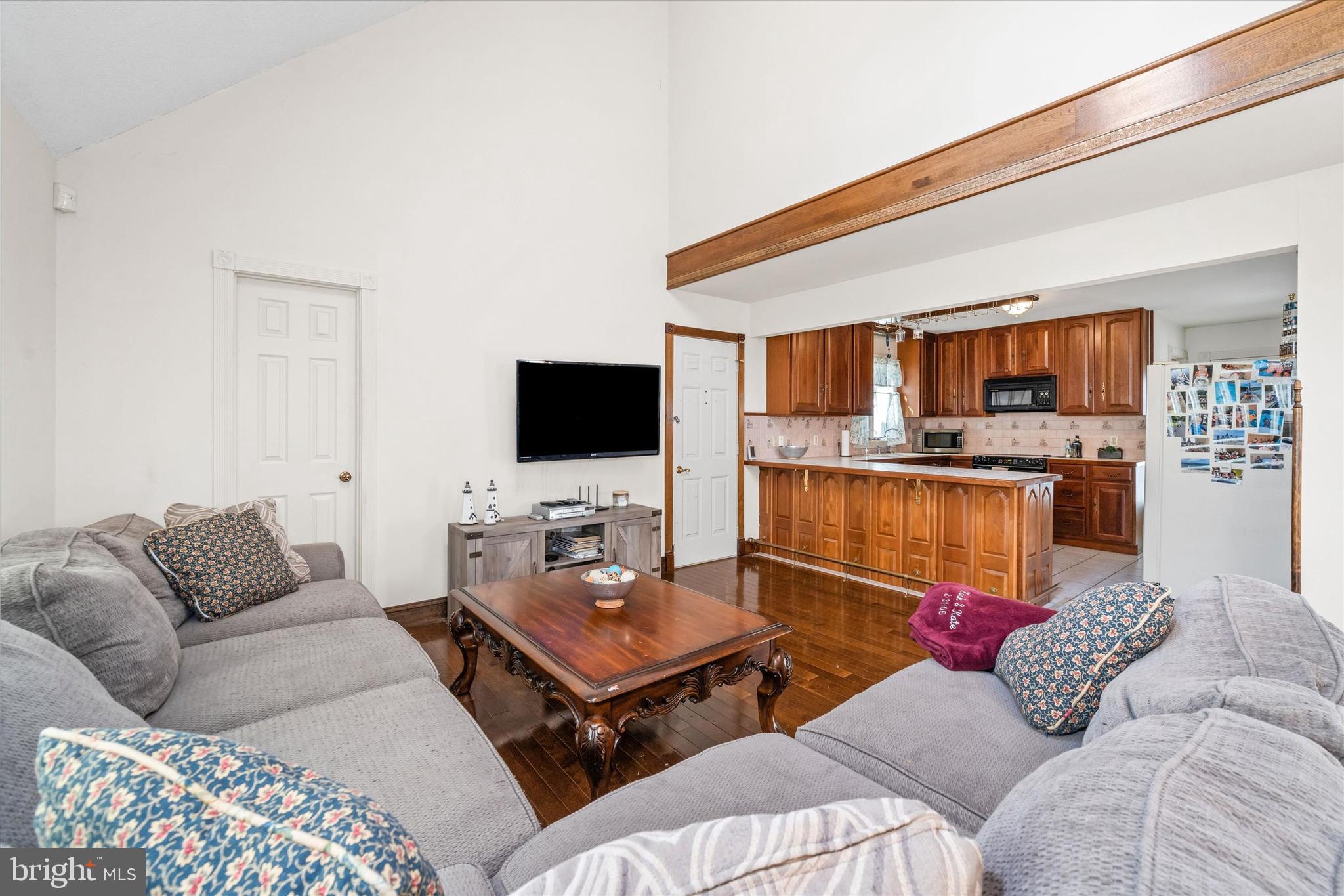 22892 Angola Road East Lewes, DE 19958 - Photo 6 of 48 a living room with furniture and a flat screen tv