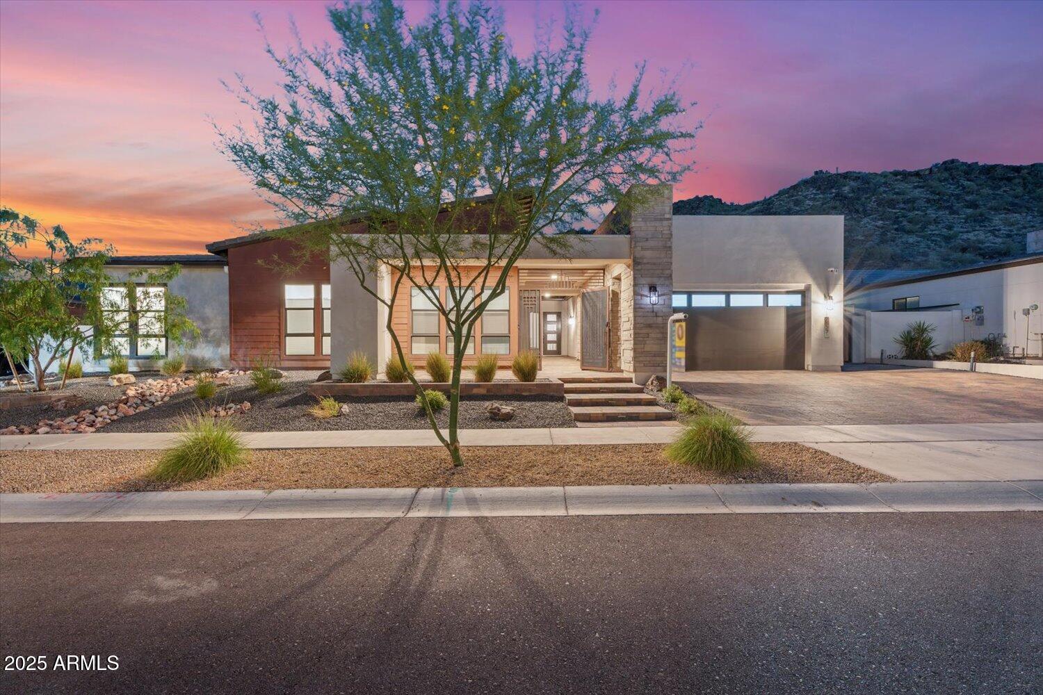 9527 South 13th Way Phoenix, AZ 85042 - Photo 1 of 44 a front view of a house with a yard