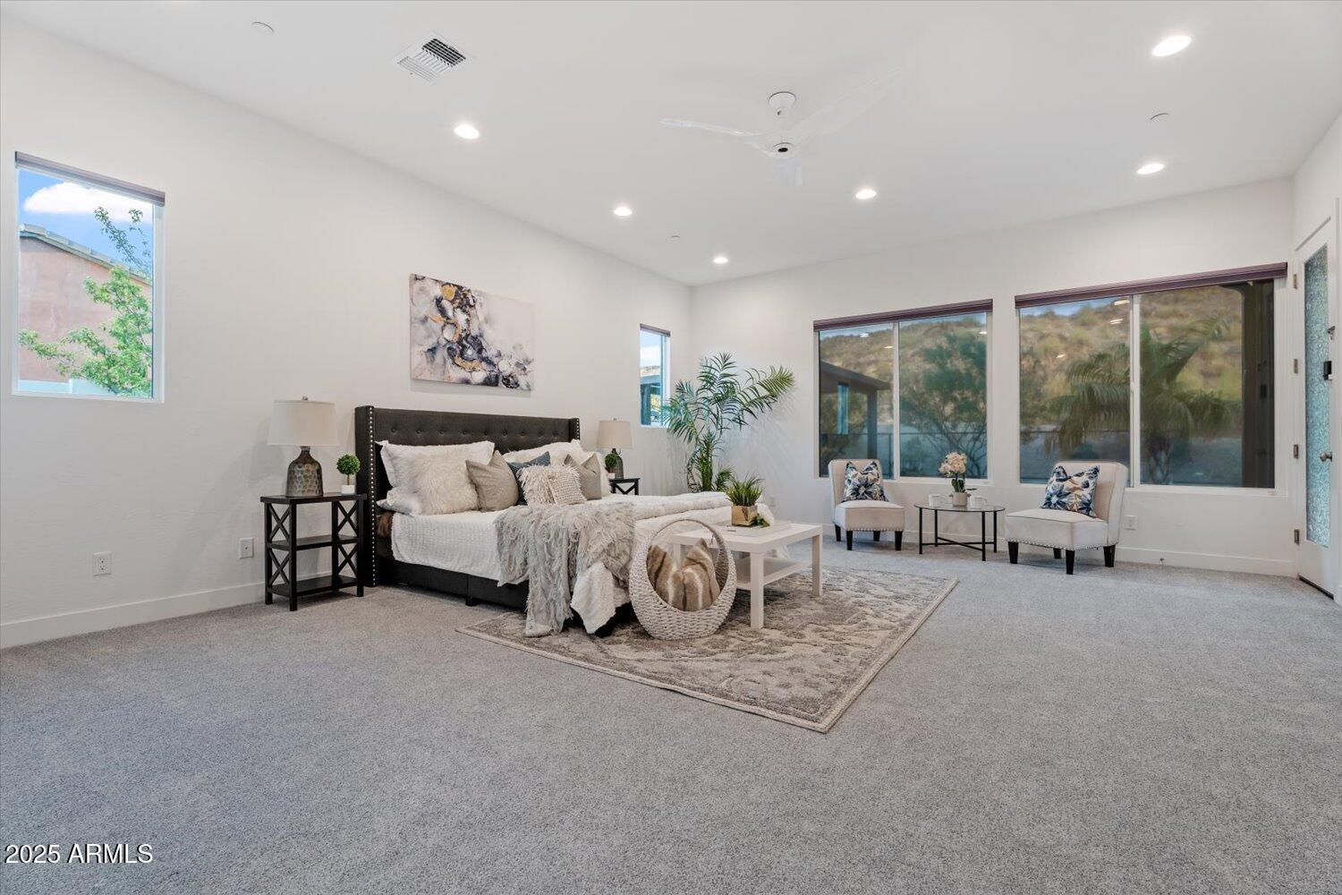 9527 South 13th Way Phoenix, AZ 85042 - Photo 11 of 44 a spacious bedroom with a bed and a large window