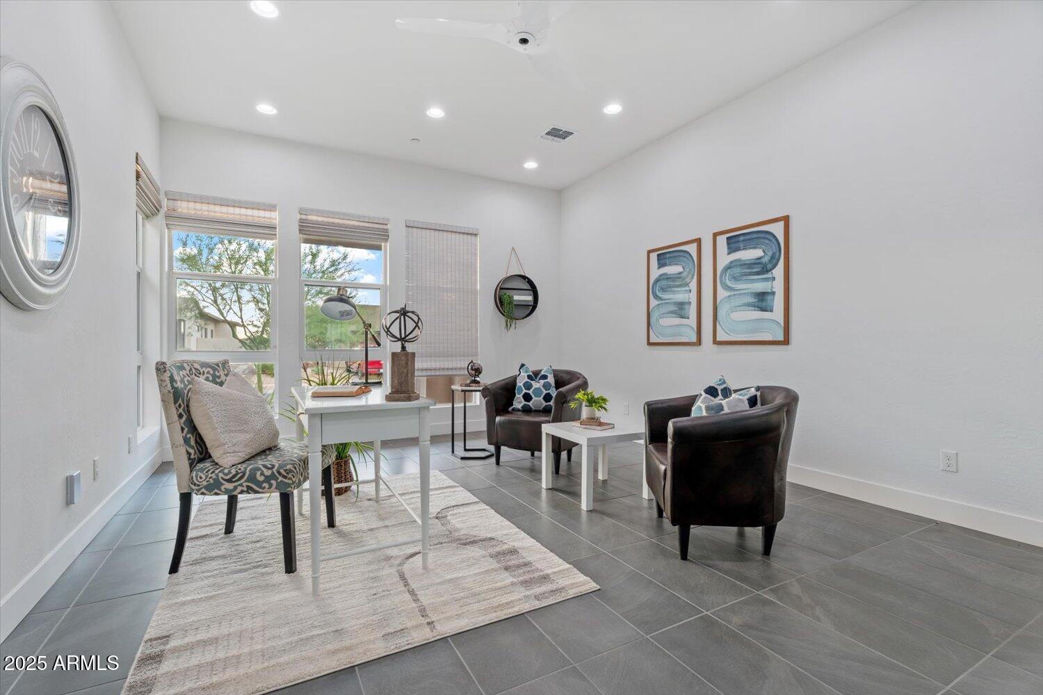 9527 South 13th Way Phoenix, AZ 85042 - Photo 19 of 44 a living room with furniture a piano and a large window