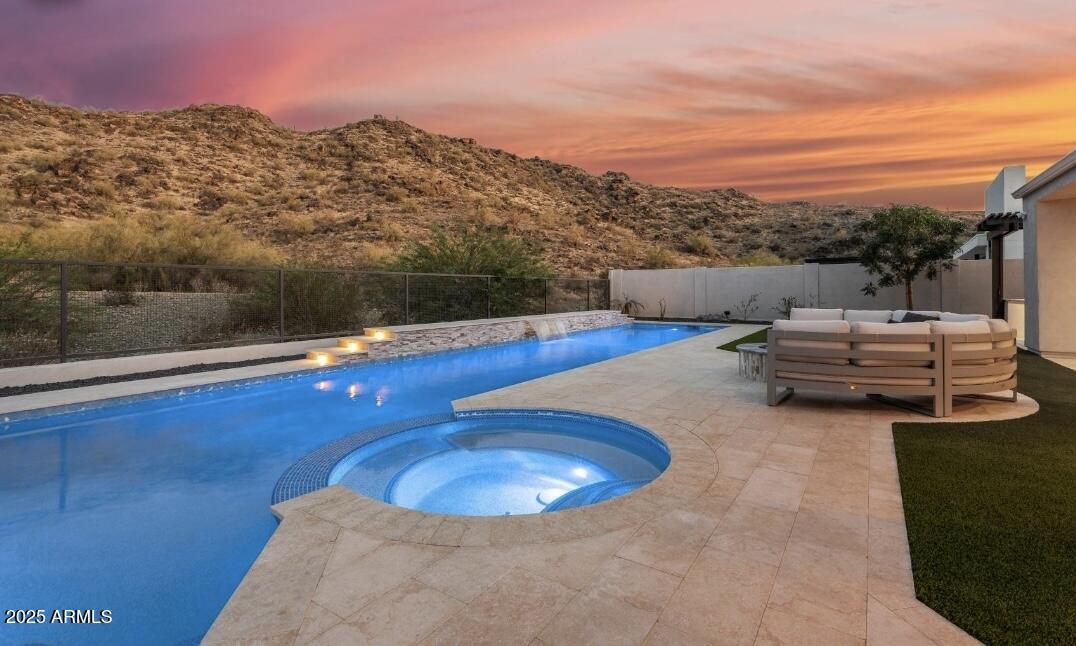 9527 South 13th Way Phoenix, AZ 85042 - Photo 24 of 44 a view of a balcony with chairs and wooden floor