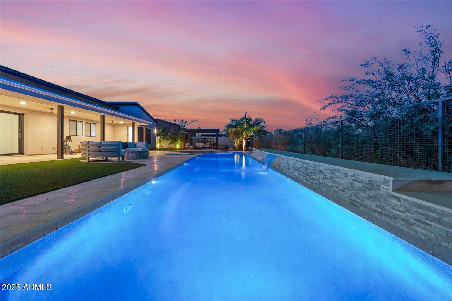 9527 South 13th Way Phoenix, AZ 85042 - Photo 31 of 44 a view of an house with backyard and a swimming pool