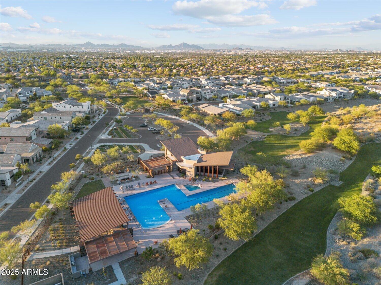 9527 South 13th Way Phoenix, AZ 85042 - Photo 36 of 44 an aerial view of a city with lots of residential buildings ocean and mountain view in back