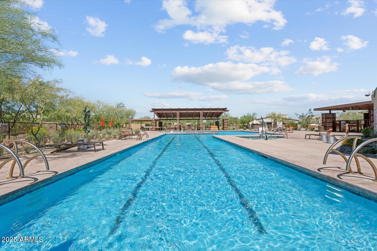9527 South 13th Way Phoenix, AZ 85042 - Photo 37 of 44 a view of swimming pool with seating area and trees