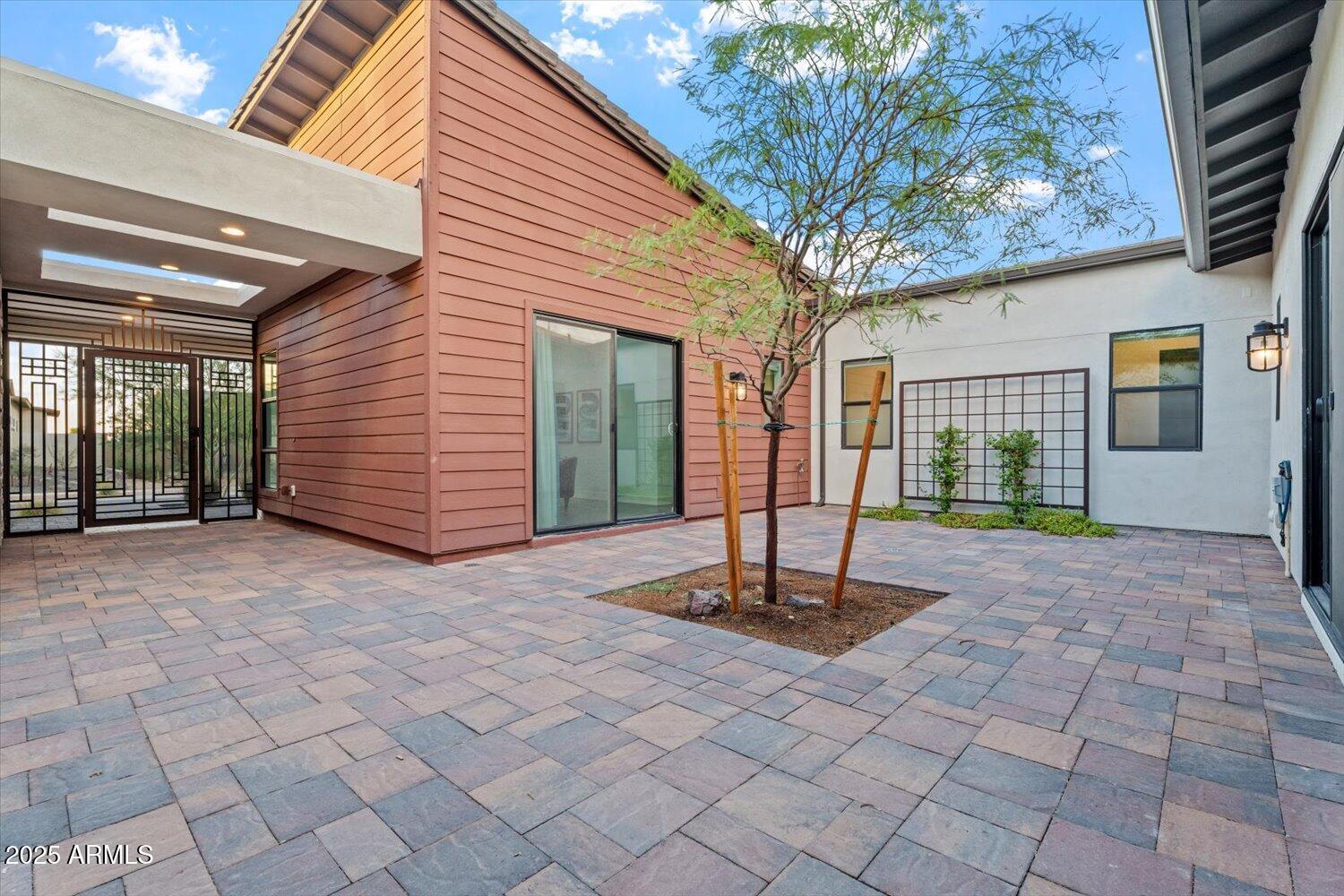 9527 South 13th Way Phoenix, AZ 85042 - Photo 4 of 44 a house with trees in front of it