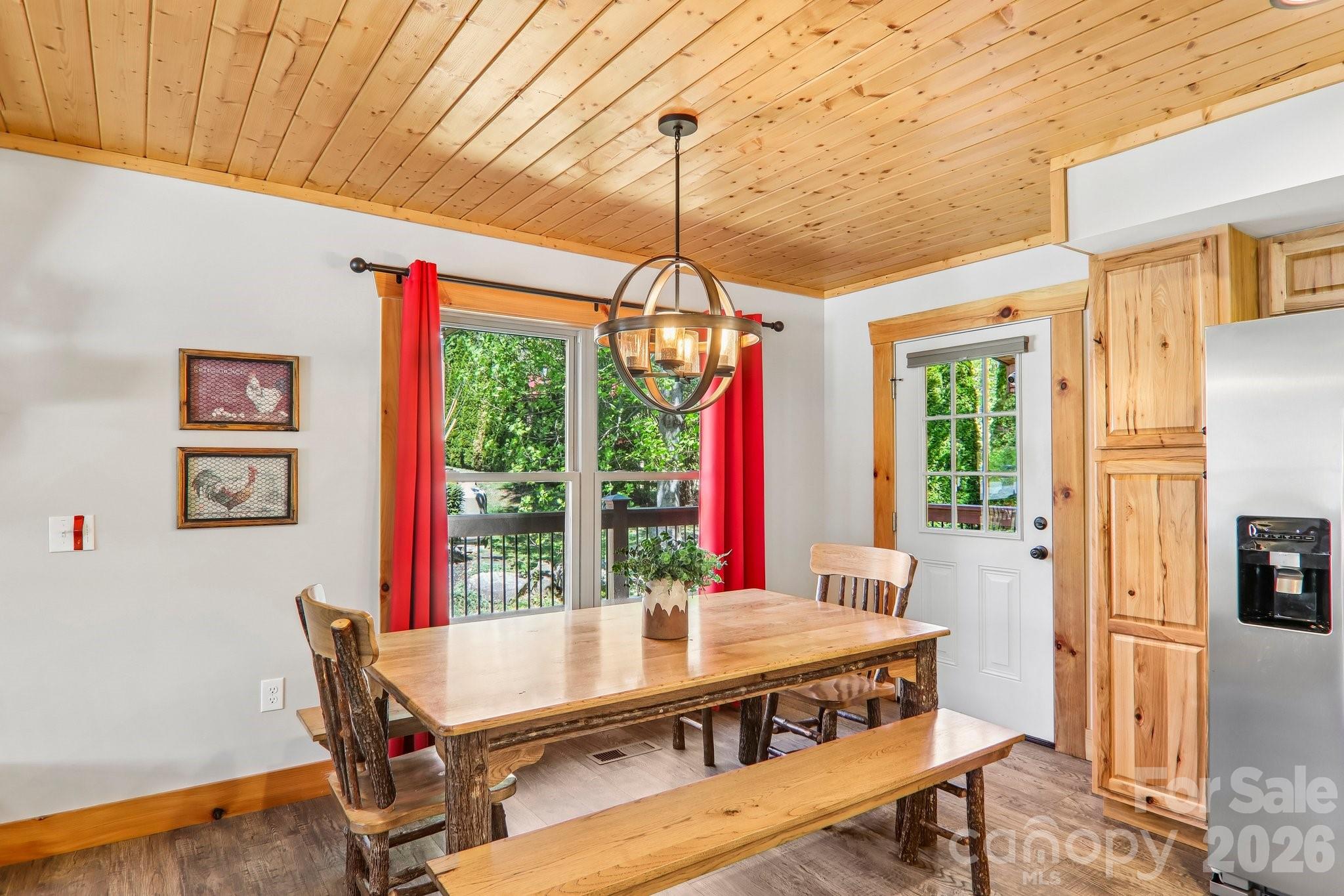 589 Panoramic Loop Maggie Valley, NC 28751 - Photo 11 of 47 a view of a dining room with furniture window and outside view