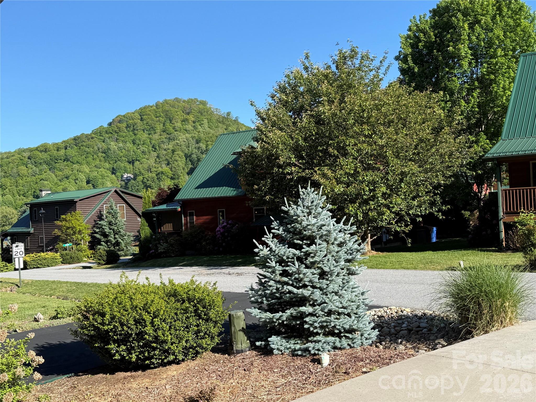 589 Panoramic Loop Maggie Valley, NC 28751 - Photo 20 of 47 a front view of a house with a yard