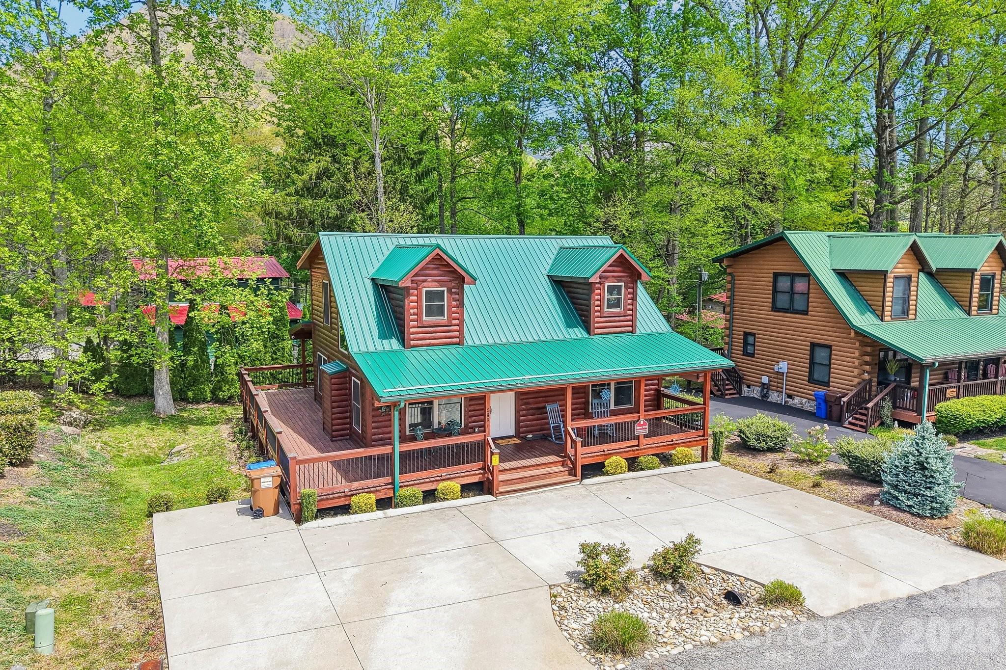 589 Panoramic Loop Maggie Valley, NC 28751 - Photo 42 of 47 a backyard of a house with lots of green space and fountain