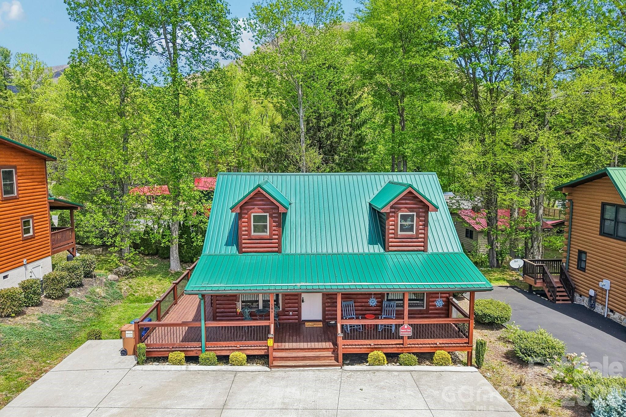 589 Panoramic Loop Maggie Valley, NC 28751 - Photo 44 of 47 a front view of a house with garden
