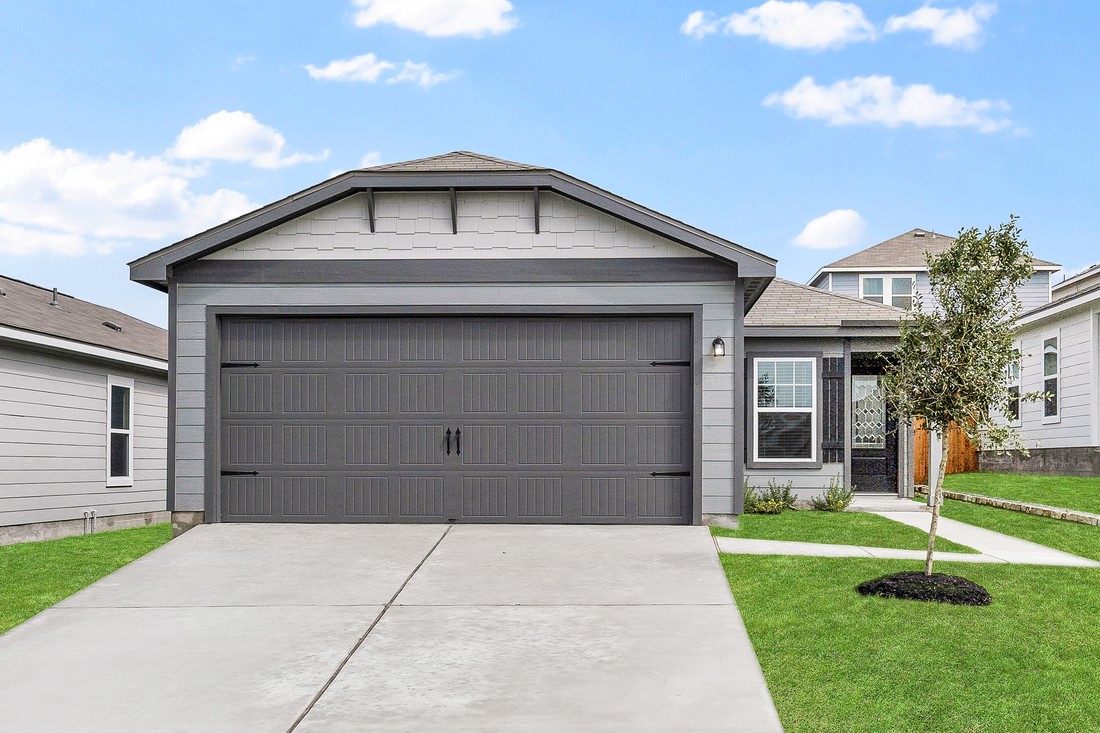 125 Morrison Drive Jarrell, TX 76537 - Photo 1 of 10 a front view of a house with a yard and garage