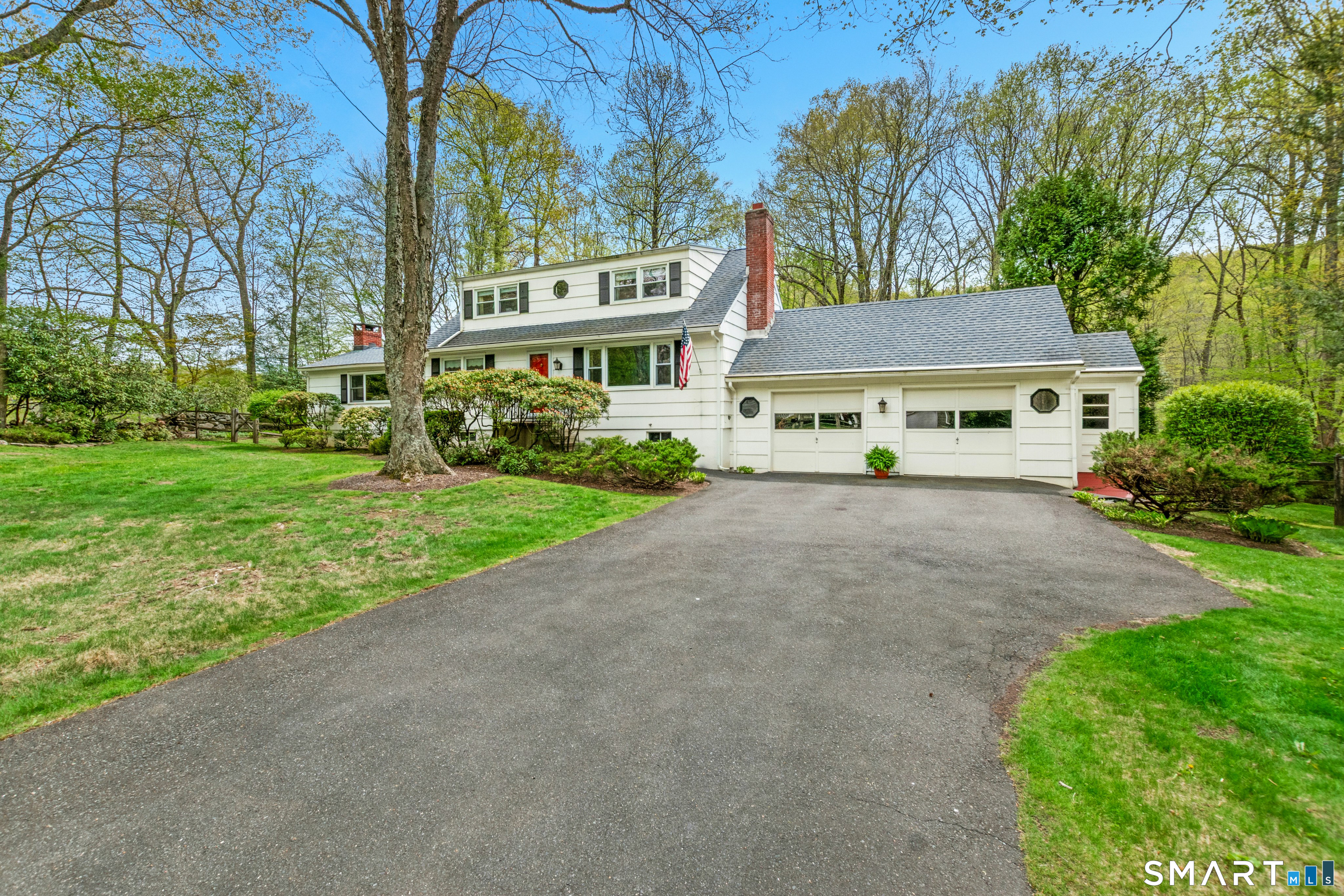 15 Limestone Terrace Ridgefield, CT 06877 - Photo 2 of 32 a view of a building with a yard and large trees