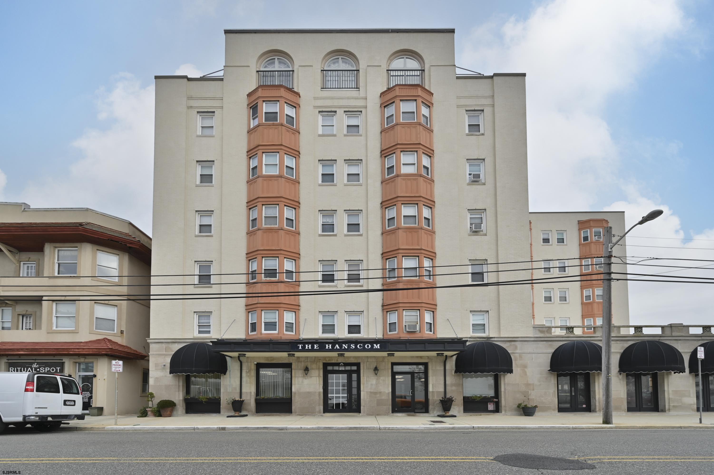807 East 8th Street, Unit 208 Ocean City, NJ 08226 - Photo 1 of 21 a front view of a building with glass windows