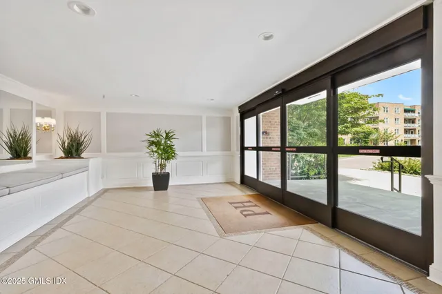 a swimming pool with outdoor seating and yard