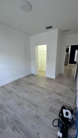 a view of a livingroom with wooden floor