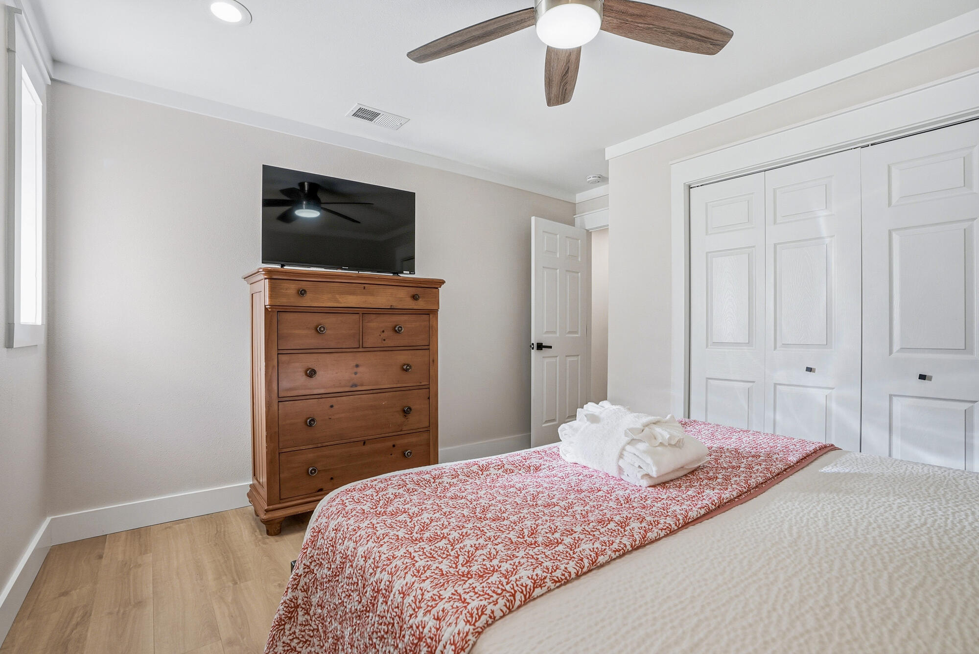 18 Initial Lane Santa Rosa Beach, FL 32459 - Photo 22 of 60 a bedroom with a bed and a flat tv screen on dresser