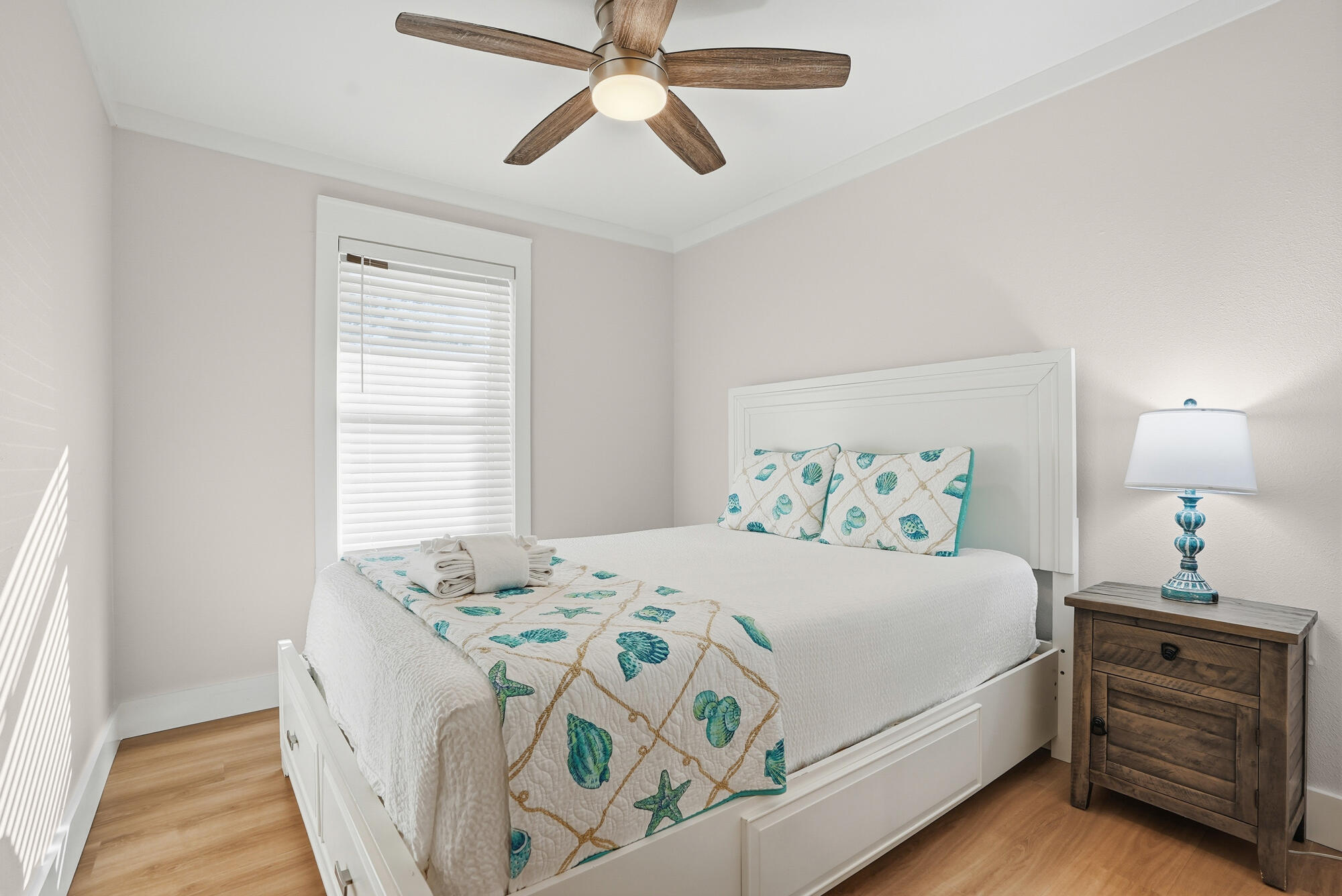 18 Initial Lane Santa Rosa Beach, FL 32459 - Photo 23 of 60 a bedroom with a bed and a chandelier