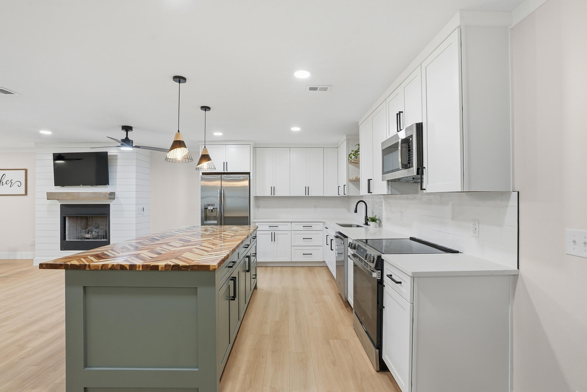 18 Initial Lane Santa Rosa Beach, FL 32459 - Photo 27 of 60 a kitchen with stainless steel appliances granite countertop a stove sink and cabinets