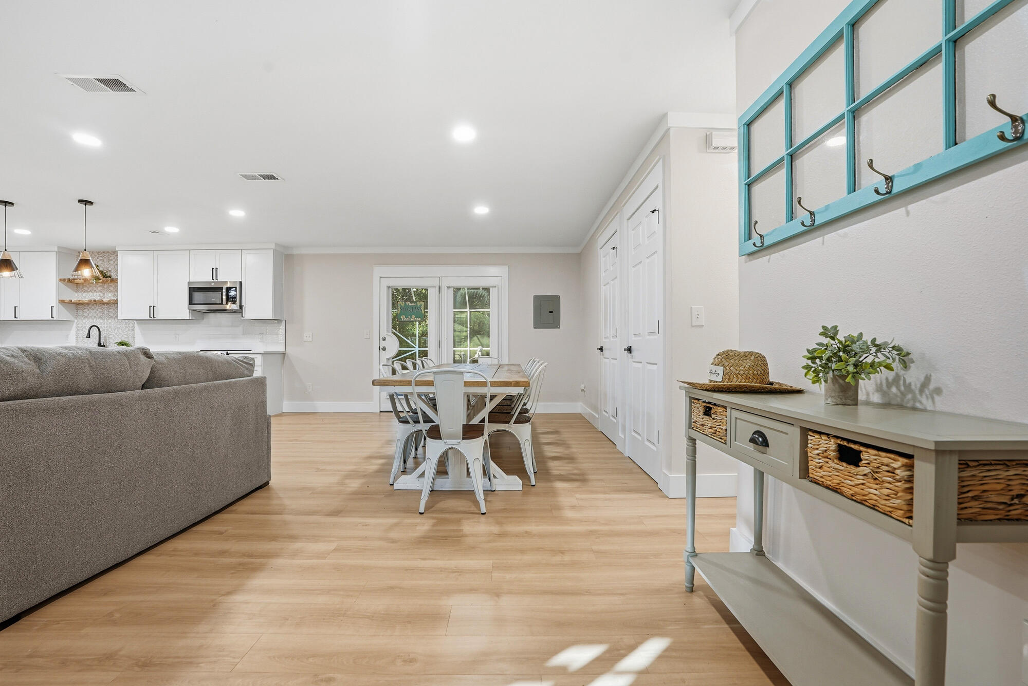 18 Initial Lane Santa Rosa Beach, FL 32459 - Photo 33 of 60 a living room with furniture a potted plant and kitchen view