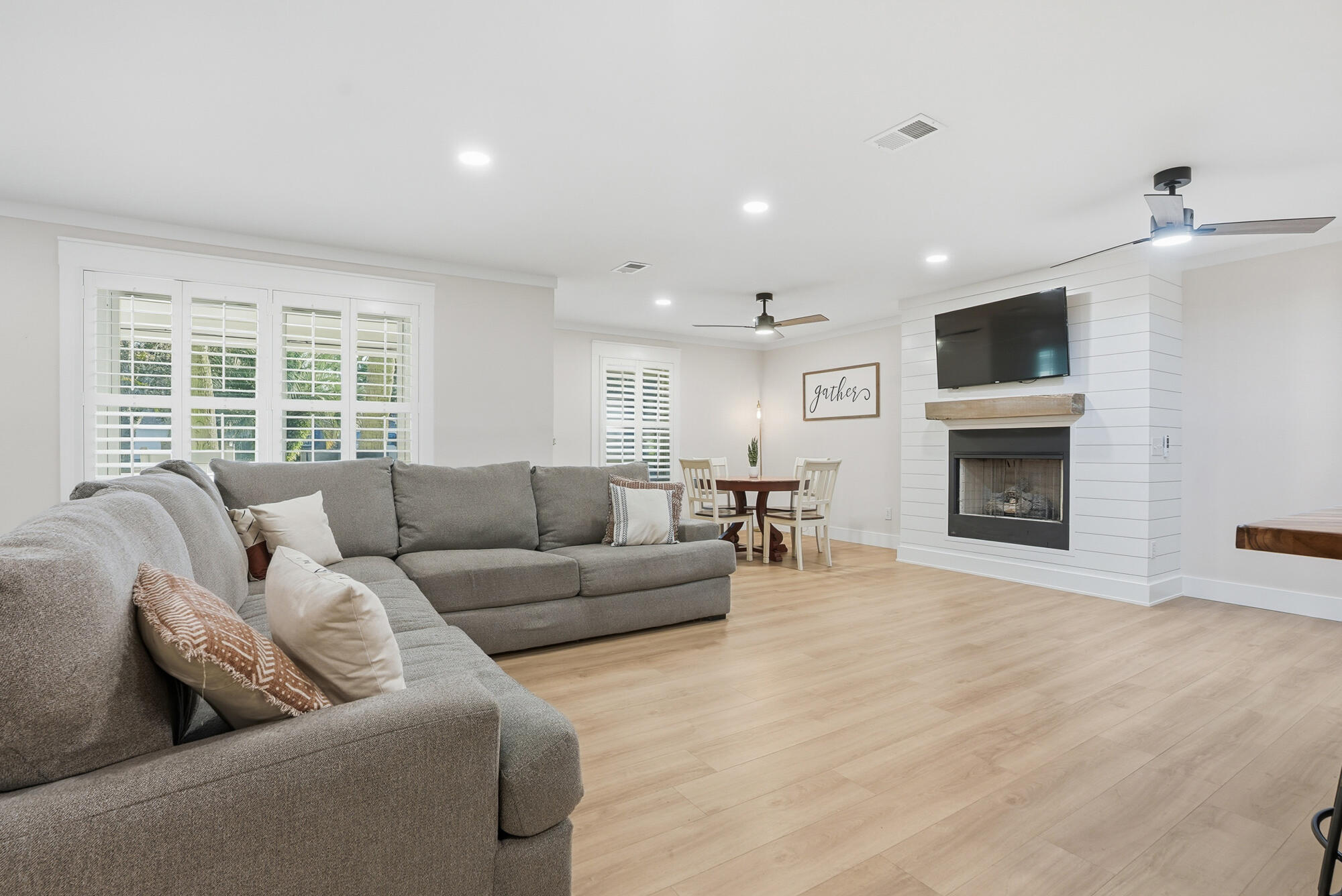 18 Initial Lane Santa Rosa Beach, FL 32459 - Photo 34 of 60 a living room with furniture a flat screen tv and a fireplace