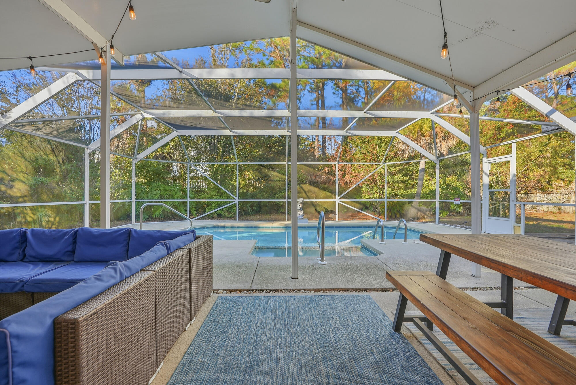 18 Initial Lane Santa Rosa Beach, FL 32459 - Photo 41 of 60 a view of a balcony with chairs and wooden floor
